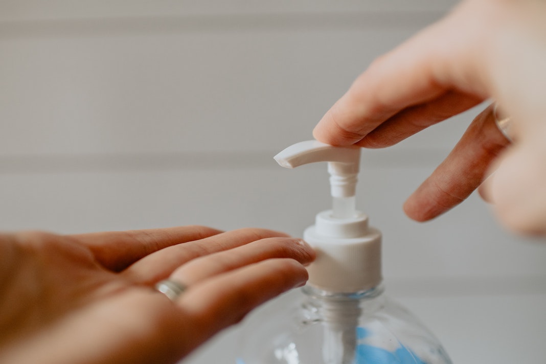 hand sanitizer use in workplaces prevent transmission